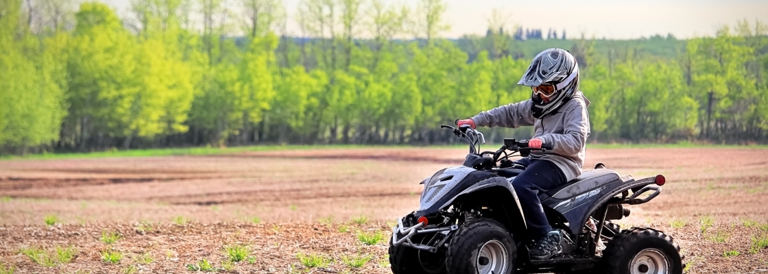 A person enjoying driving an off-road vehicle in nature